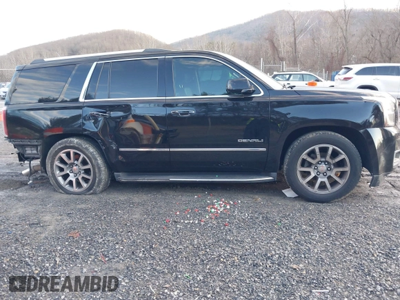 2016 GMC Yukon Denali with VIN 1GKS2CKJ2GR412201, listed as a IAAI auction lot 41185716 with 124,421 mi miles. Bid and sale history available at carsss.com. Image 13.