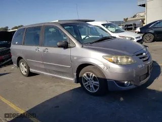 2004 Mazda MPV LX with VIN JM3LW28AX40506050, listed as a Copart auction lot 74335234 with 211,708 mi miles and Salvage Title. Bid and sale history available at carsss.com. Image 4.