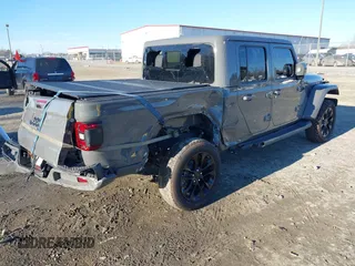 2022 Jeep Gladiator High Altitude with VIN 1C6HJTFGXNL124571, listed as a IAAI auction lot 41272140 with 14,198 mi miles and . Bid and sale history available at DreamBid. Image 4.