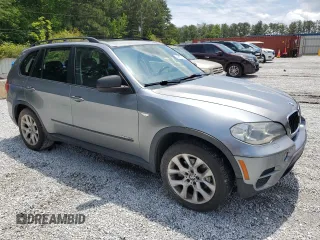 2012 BMW X5 35i with VIN 5UXZV4C50CL991452, listed as a Copart auction lot 56890265 with 147,019 mi miles and Salvage title. Bid and sale history available at DreamBid. Image 4.