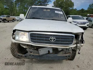 1999 Toyota Land Cruiser z VIN JT3HT05J5X0050404, wystawiony jako Copart lot #56066125 z przebiegiem 385 659 mil mil oraz Tytuł czysty. Historia ofert i sprzedaży dostępna na DreamBid. Obrazek 5.