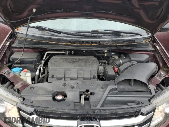 2014 Honda Odyssey LX z VIN 5FNRL5H24EB098072, wystawiony jako Copart lot #57577385 z przebiegiem 215 069 mil mil oraz Szkoda całkowita • Salvage title. Historia ofert i sprzedaży dostępna na DreamBid. Obrazek 12.