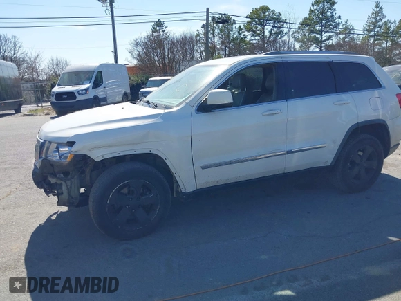 2012 Jeep Grand Cherokee Laredo with VIN 1C4RJFAT4CC229204, listed as a IAAI auction lot 41659491 with 141,143 mi miles. Bid and sale history available at carsss.com. Image 17.