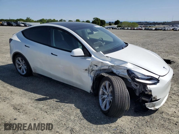 2022 Tesla Model Y Long Range z VIN 7SAYGAEE6NF492070, wystawiony jako Copart lot #52032415 z przebiegiem 143 732 mil mil oraz Szkody całkowita. Historia ofert i sprzedaży dostępna na DreamBid. Obrazek 4.