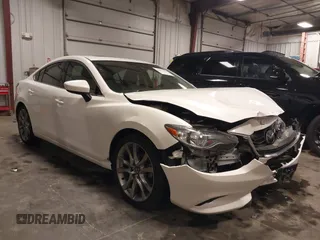 2015 Mazda 6 i Grand Touring with VIN JM1GJ1W50F1191197, listed as a IAAI auction lot 42042076 with 99,215 mi miles and . Bid and sale history available at DreamBid. Image 1.