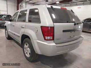 2007 Jeep Grand Cherokee Laredo with VIN 1J8GR48K57C687365, listed as a IAAI auction lot 42038456 with 162,343 mi miles. Bid and sale history available at carsss.com. Image 3.
