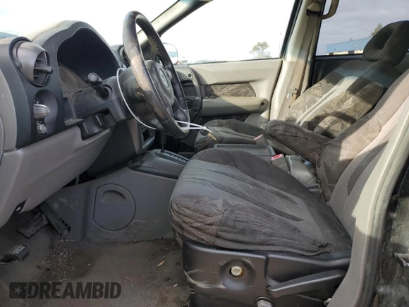 2002 Pontiac Aztek z VIN 3G7DA03E22S584224, wystawiony jako Copart lot #87851655 z przebiegiem 218 653 mil mil oraz Szkoda całkowita • Salvage title. Historia ofert i sprzedaży dostępna na DreamBid. Obrazek 7.