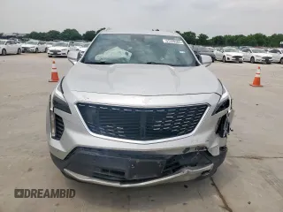 2021 Cadillac XT4 FWD Premium Luxury z VIN 1GYFZCR42MF004233, wystawiony jako Copart lot #57229385 z przebiegiem 98 387 mil mil oraz Szkody całkowita. Historia ofert i sprzedaży dostępna na DreamBid. Obrazek 5.