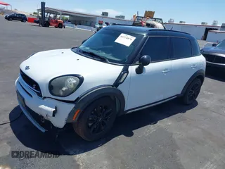 2015 MINI Countryman S with VIN WMWZC3C58FWT05613, listed as a IAAI auction lot 42374870 with 124,214 mi miles and . Bid and sale history available at DreamBid. Image 13.
