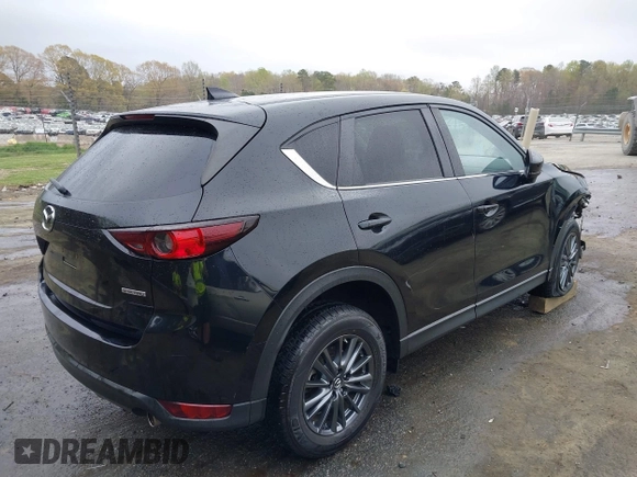 2020 Mazda CX-5 Touring with VIN JM3KFACM9L0770933, listed as a IAAI auction lot 41921464 with 75,997 mi miles. Bid and sale history available at carsss.com. Image 4.