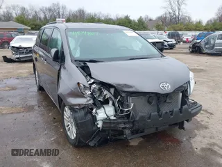 2015 Toyota Sienna XLE with VIN 5TDYK3DC8FS651580, listed as a IAAI auction lot 41971867 with 49,711 mi miles. Bid and sale history available at carsss.com. Image 1.