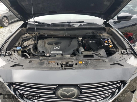 2016 Mazda CX-9 Grand Touring z VIN JM3TCADY7G0122768, wystawiony jako Copart lot #65624615 z przebiegiem 82 388 mil mil oraz Czysty tytuł • Clean title. Historia ofert i sprzedaży dostępna na DreamBid. Obrazek 12.