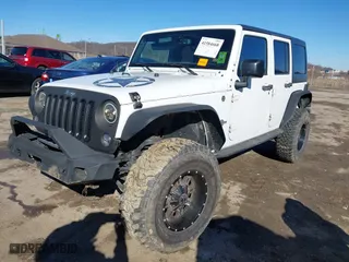 2015 Jeep Wrangler Unlimited Sport with VIN 1C4BJWDG6FL563237, listed as a IAAI auction lot 41584668 with 105,038 mi miles. Bid and sale history available at carsss.com. Image 18.