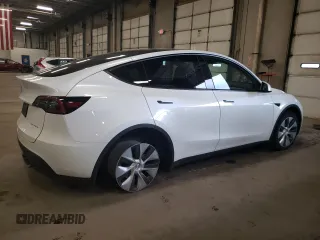 2023 Tesla Model Y Long Range z VIN 7SAYGDEE5PA067389, wystawiony jako Copart lot #54109625 z przebiegiem 24 849 mil mil oraz Szkody całkowita. Historia ofert i sprzedaży dostępna na DreamBid. Obrazek 3.