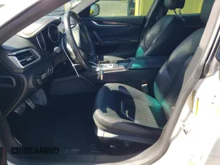 2016 Maserati Ghibli z VIN ZAM57XSA8G1166993, wystawiony jako Copart lot #51677735 z przebiegiem 58 215 mil mil oraz Tytuł czysty. Historia ofert i sprzedaży dostępna na DreamBid. Obrazek 7.