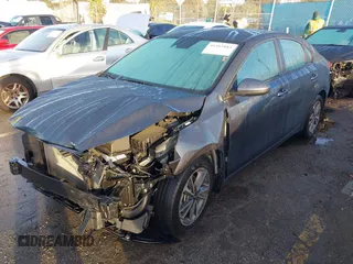 2023 Kia Forte LXS with VIN 3KPF24AD7PE536653, listed as a IAAI auction lot 41562883 with 32,700 mi miles and . Bid and sale history available at DreamBid. Image 2.