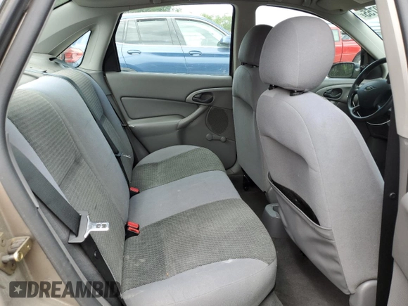 2004 Ford Focus LX with VIN 1FAFP33P24W148563, listed as a Copart auction lot 63869755 with 142,243 mi miles and Salvage title. Bid and sale history available at DreamBid. Image 10.