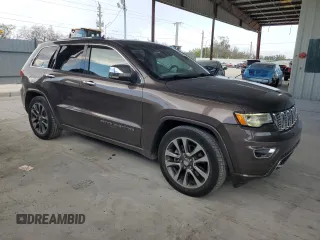 2017 Jeep Grand Cherokee Overland with VIN 1C4RJFCTXHC768687, listed as a Copart auction lot 51442495 with 123,578 mi miles and Clean Title. Bid and sale history available at carsss.com. Image 4.