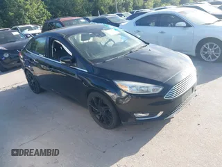 2016 Ford Focus Titanium z VIN 1FADP3J26GL335843, wystawiony jako IAAI lot #42799795 z przebiegiem 167 506 mil mil oraz . Historia ofert i sprzedaży dostępna na DreamBid. Obrazek 1.