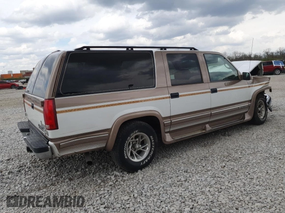 1999 Chevrolet Suburban with VIN 3GNEC16R9XG143471, listed as a Copart auction lot 53856565 with 208,621 mi miles and Salvage title. Bid and sale history available at DreamBid. Image 3.