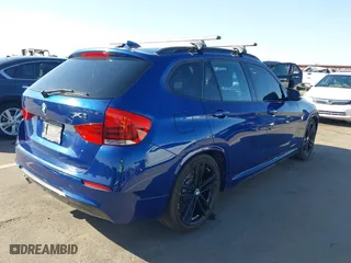 2015 BMW X1 xDrive28i with VIN WBAVL1C56FVY32753, listed as a IAAI auction lot 41759454 with 130,823 mi miles. Bid and sale history available at carsss.com. Image 4.