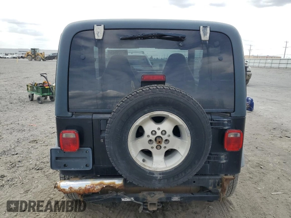 2000 Jeep Wrangler Sport z VIN 1J4FA49S9YP798353, wystawiony jako Copart lot #62009645 z przebiegiem 116 676 mil mil oraz Szkoda całkowita • Salvage title. Historia ofert i sprzedaży dostępna na DreamBid. Obrazek 6.