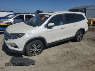 2018 Honda Pilot EX-L with VIN 5FNYF6H54JB013986, listed as a Copart auction lot 60743165 with 124,373 mi miles and Salvage title. Bid and sale history available at DreamBid. Image 1.