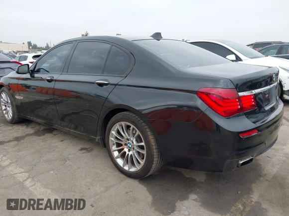 2015 BMW 7 Series 740i with VIN WBAYA6C54FG273188, listed as a IAAI auction lot 42563572 with 70,675 mi miles and . Bid and sale history available at DreamBid. Image 3.