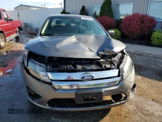 2012 Ford Fusion SE z VIN 3FAHP0HA0CR437115, wystawiony jako Copart lot #56583495 z przebiegiem 159 649 mil mil oraz Szkoda całkowita • Salvage title. Historia ofert i sprzedaży dostępna na DreamBid. Obrazek 5.