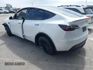 2023 Tesla Model Y Long Range with VIN 7SAYGDEE9PA026005, listed as a IAAI auction lot 41895223 with 43,813 mi miles and . Bid and sale history available at DreamBid. Image 3.