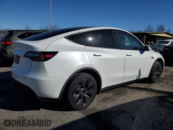 2024 Tesla Model Y with VIN 7SAYGDED9RF094494, listed as a Copart auction lot 50298115 with 7,858 mi miles and Salvage Title. Bid and sale history available at DreamBid. Image 3.