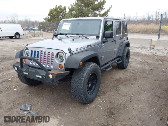 2013 Jeep Wrangler Unlimited Rubicon z VIN 1C4BJWFG7DL667083, wystawiony jako IAAI lot #42016912 z przebiegiem 148 933 mil mil oraz . Historia ofert i sprzedaży dostępna na DreamBid. Obrazek 2.