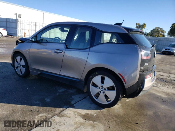 2015 BMW i3 with VIN WBY1Z4C56FV500991, listed as a Copart auction lot 43162913 with 57,885 mi miles. Bid and sale history available at carsss.com. Image 2.