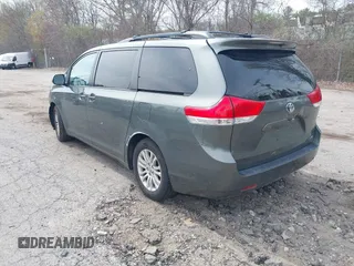 2012 Toyota Sienna XLE AAS with VIN 5TDYK3DC1CS199113, listed as a IAAI auction lot 42123757 with 211,723 mi miles and . Bid and sale history available at carsss.com. Image 3.
