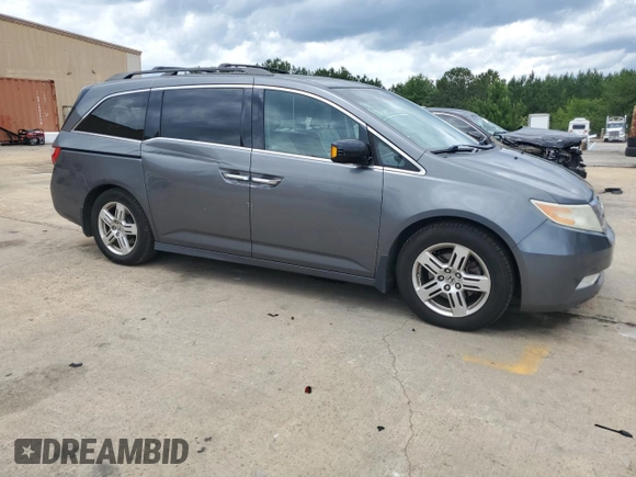 2012 Honda Odyssey Touring with VIN 5FNRL5H90CB050580, listed as a Copart auction lot 58502925 with 226,929 mi miles and Salvage title. Bid and sale history available at DreamBid. Image 4.