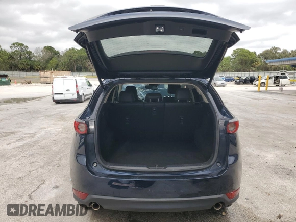 2021 Mazda CX-5 Grand Touring with VIN JM3KFADM9M0401778, listed as a Copart auction lot 46227515 with 44,587 mi miles and Non Repairable. Bid and sale history available at carsss.com. Image 6.