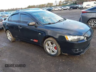 2008 Mitsubishi Lancer DE with VIN JA3AU26U58U004840, listed as a IAAI auction lot 41515756 with 117,996 mi miles. Bid and sale history available at carsss.com. Image 1.