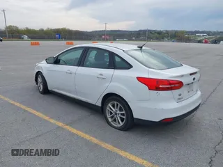 2015 Ford Focus SE with VIN 1FADP3F23FL255584, listed as a IAAI auction lot 41990636 with 151,389 mi miles. Bid and sale history available at carsss.com. Image 3.