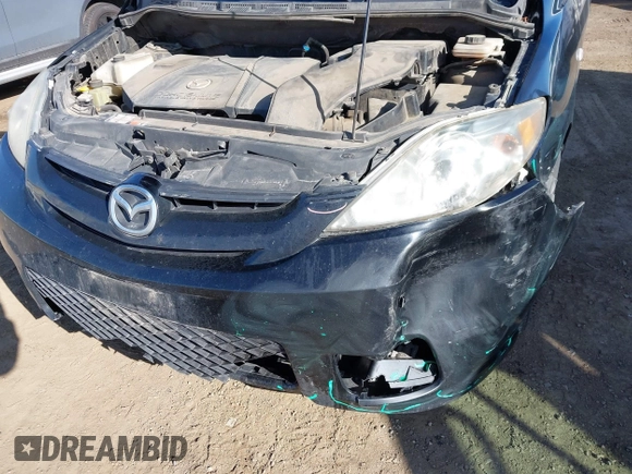 2007 Mazda 5 Touring with VIN JM1CR293970135693, listed as a IAAI auction lot 41976260 with 211,978 mi miles and . Bid and sale history available at carsss.com. Image 6.