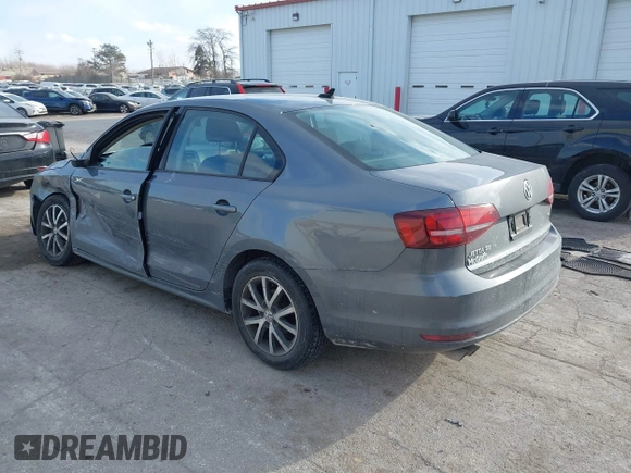 2016 Volkswagen Jetta Sedan 1.4T SE with VIN 3VWD67AJ7GM281671, listed as a IAAI auction lot 41385896 with 153,168 mi miles. Bid and sale history available at carsss.com. Image 3.