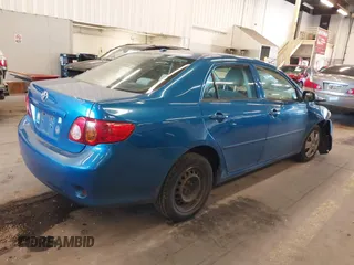 2009 Toyota Corolla with VIN 1NXBU40E19Z027256, listed as a IAAI auction lot 41383298 with 221,545 mi miles. Bid and sale history available at carsss.com. Image 4.