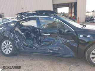 2017 Kia Optima EX with VIN 5XXGU4L33HG135421, listed as a IAAI auction lot 41738011 with 128,594 mi miles. Bid and sale history available at carsss.com. Image 13.