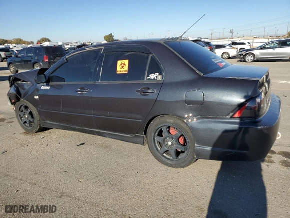 2002 Mitsubishi Lancer OZ-Rally with VIN JA3AJ86E82U024883, listed as a Copart auction lot 79145654 with 170,778 mi miles and Salvage Title. Bid and sale history available at carsss.com. Image 2.