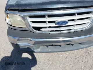 1999 Ford F-150 z VIN 1FTZX1725XKA26611, wystawiony jako IAAI lot #42037812 z przebiegiem Nie podano mil oraz . Historia ofert i sprzedaży dostępna na DreamBid. Obrazek 6.