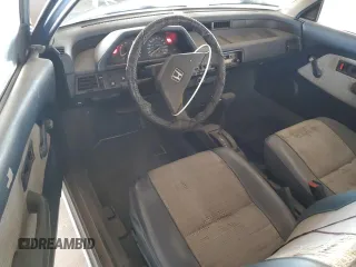 1984 Honda Civic z VIN JHMAH3321ES036981, wystawiony jako Copart lot #55697265 z przebiegiem Nie podano mil oraz Tytuł czysty. Historia ofert i sprzedaży dostępna na DreamBid. Obrazek 8.