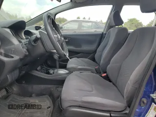 2009 Honda Fit with VIN JHMGE88229S049270, listed as a Copart auction lot 56935235 with 118,649 mi miles and Salvage title. Bid and sale history available at DreamBid. Image 7.