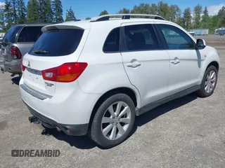 2014 Mitsubishi Outlander SE z VIN 4A4AP4AU3EE024904, wystawiony jako IAAI lot #42373011 z przebiegiem 121 482 mil mil oraz . Historia ofert i sprzedaży dostępna na DreamBid. Obrazek 4.