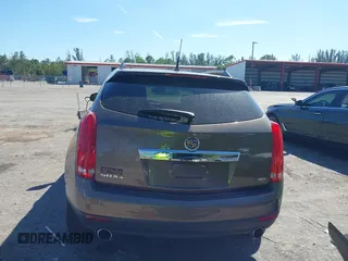 2014 Cadillac SRX Luxury Collection z VIN 3GYFNEE3XES587233, wystawiony jako IAAI lot #41747779 z przebiegiem 116 571 mil mil oraz . Historia ofert i sprzedaży dostępna na DreamBid. Obrazek 16.