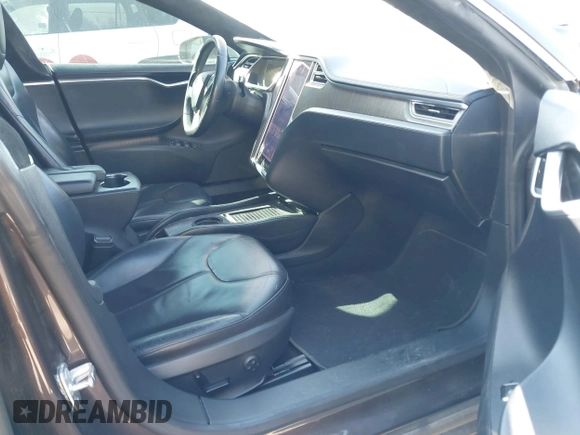 2013 Tesla Model S z VIN 5YJSA1DN4DFP19552, wystawiony jako IAAI lot #41360466 z przebiegiem 129 806 mil mil oraz . Historia ofert i sprzedaży dostępna na DreamBid. Obrazek 5.
