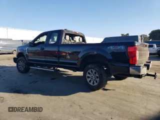 2021 Ford Super Duty F-250 SRW XL with VIN 1FT7X2BN0MEC62141, listed as a Copart auction lot 77142804 with 59,933 mi miles and Salvage Title. Bid and sale history available at carsss.com. Image 2.